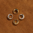 La Muse Huggie Earrings
